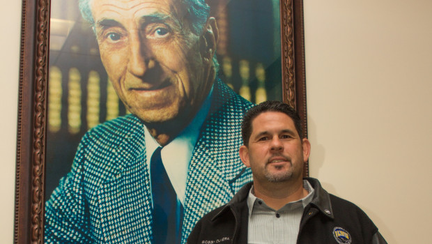 ILWU Local 13 President Bobby Olvera beneath the watchful gaze of union founder, Harry Bridges. Photo by Phillip Cooke